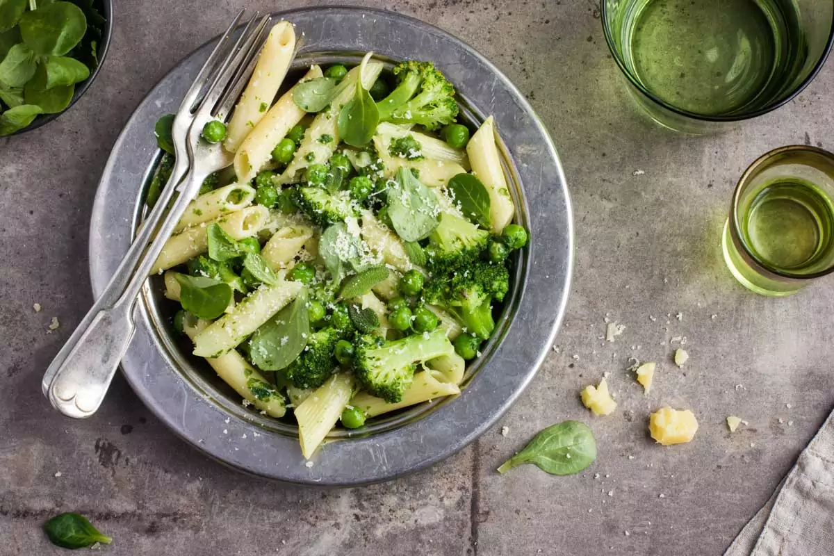 springtime veg pasta in a bowl with a fork